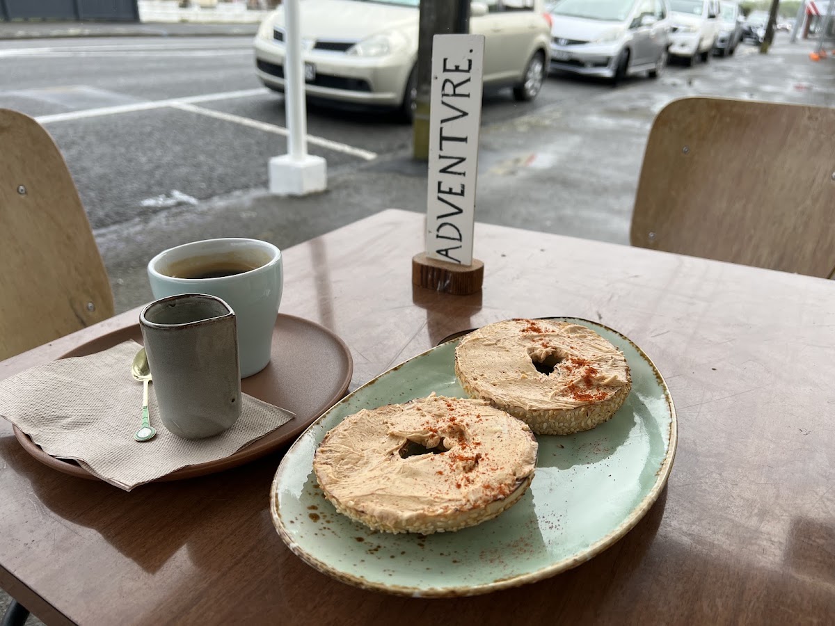 Bagels with whipped spread and coffee at the window